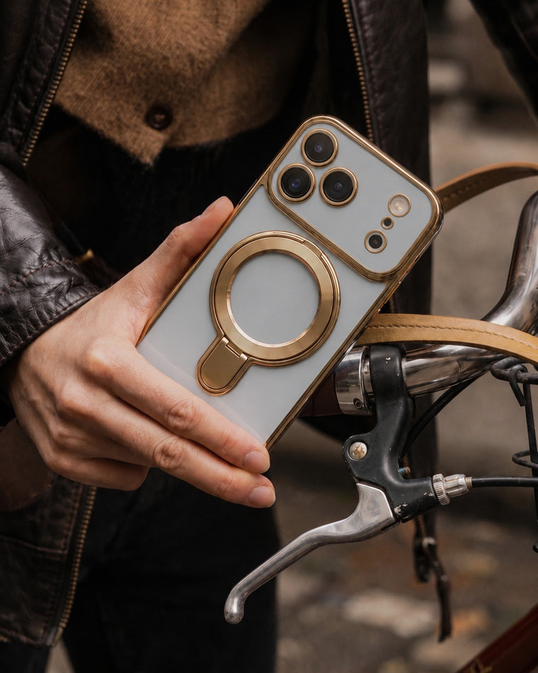 Infinity case in Light Gray held in hand, leather jacket and bicycle